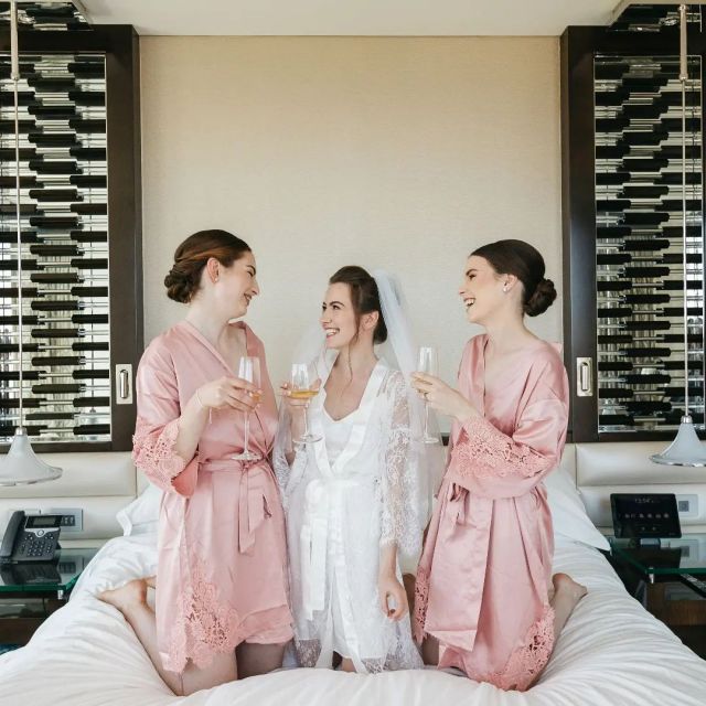 Cheers to looking as good getting ready as you do in your wedding dress! 🥂💕